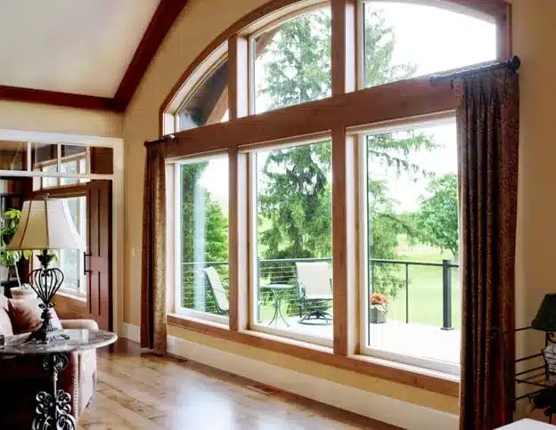 A wide view of wooden windows inside a bright house