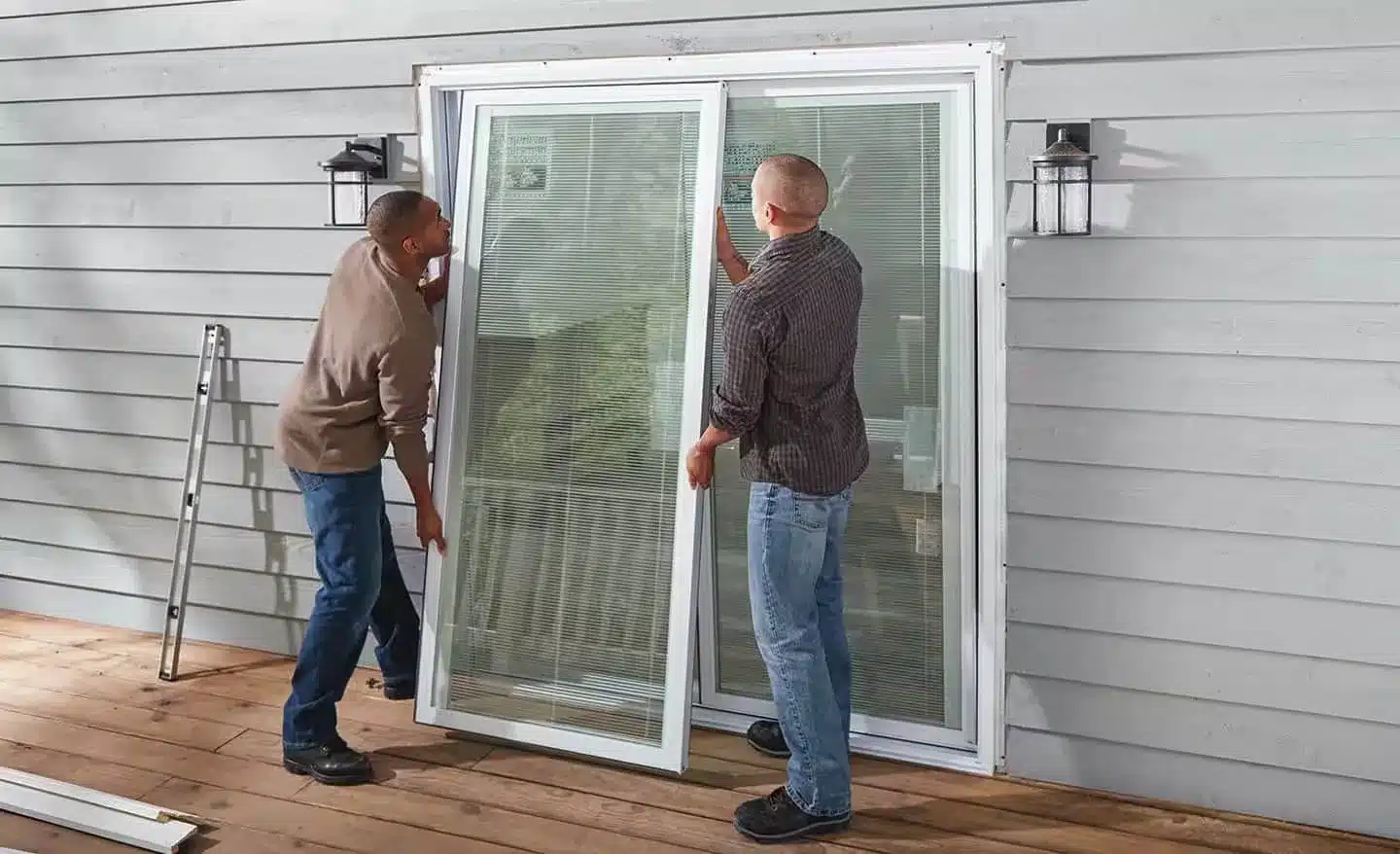 2 pros installing a sliding door