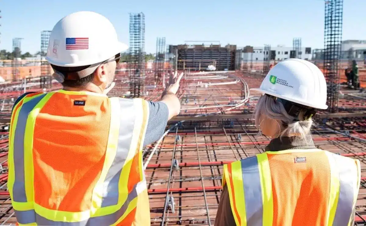 2 professional contractors discussing a construction project