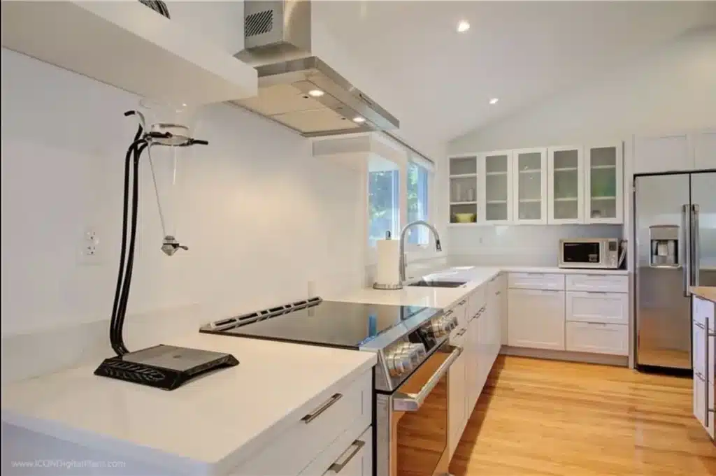 Kitchen renovation with new cabinetry and island.
