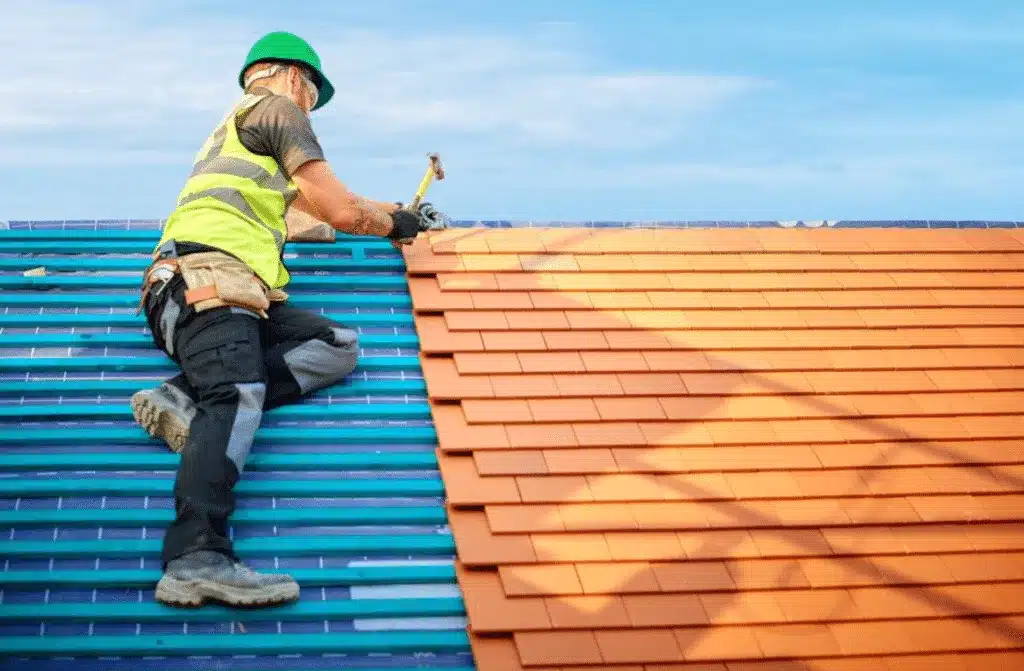 a roofer fixing a roof