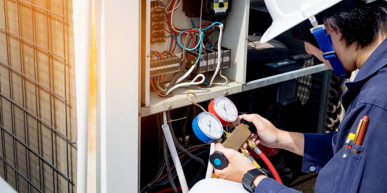 an HVAC expert checking the system