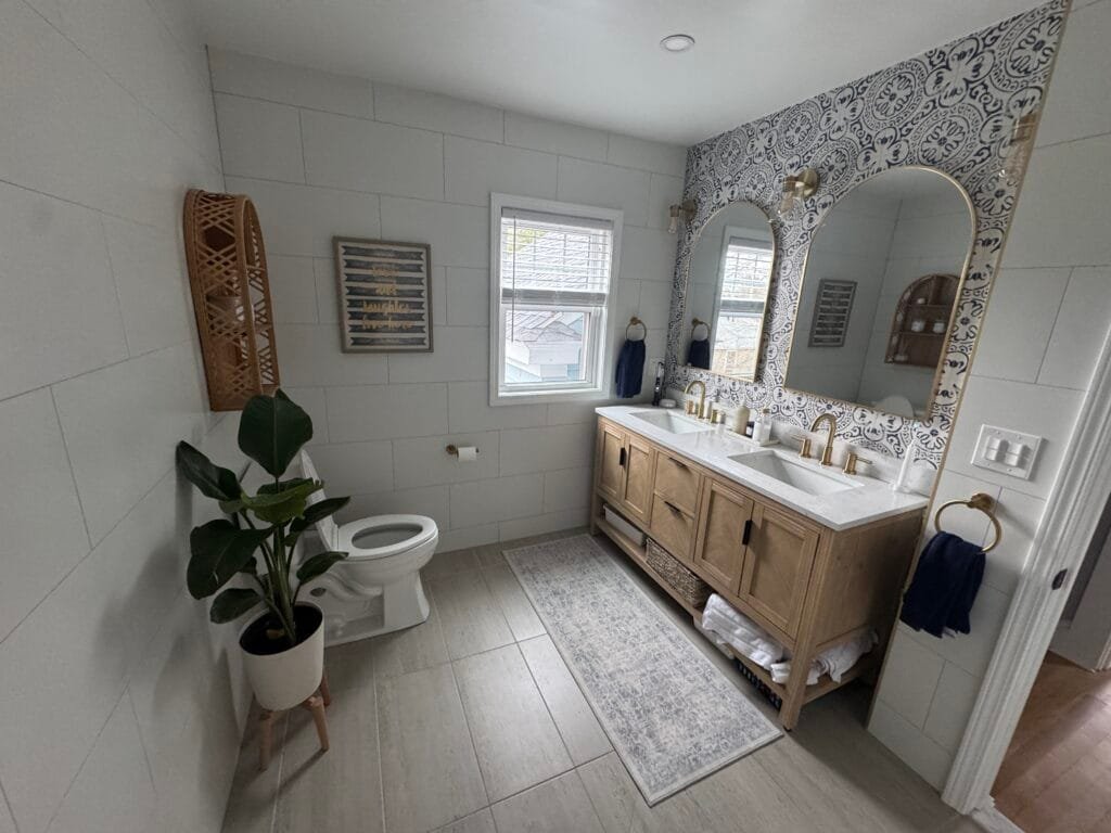 Bathroom remodel with tile, vanity and new fixtures.
