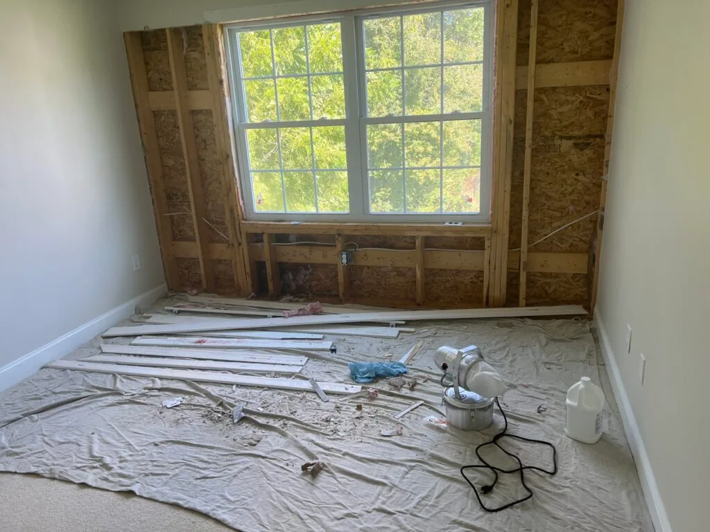 Window rough opening framing preparation before replacement.