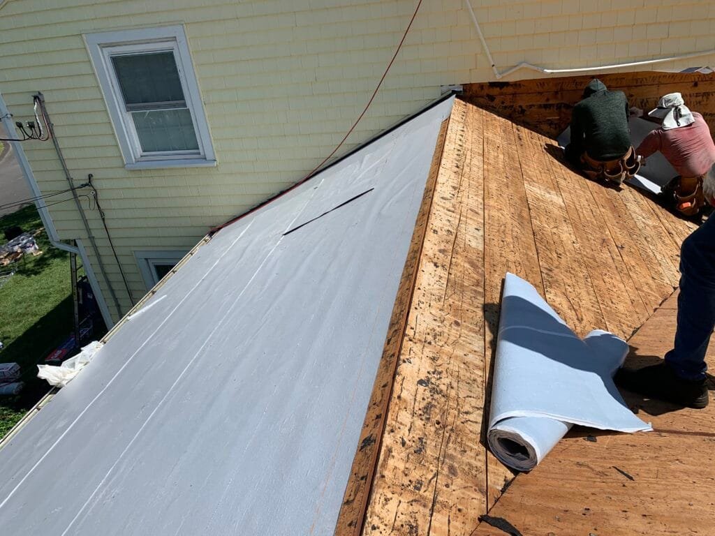 Flat roof membrane installed at a roof edge.