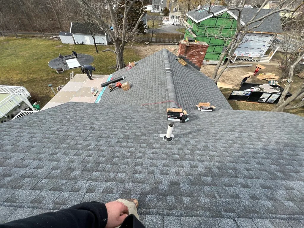 Architectural shingles going on during a GCR roof replacement.